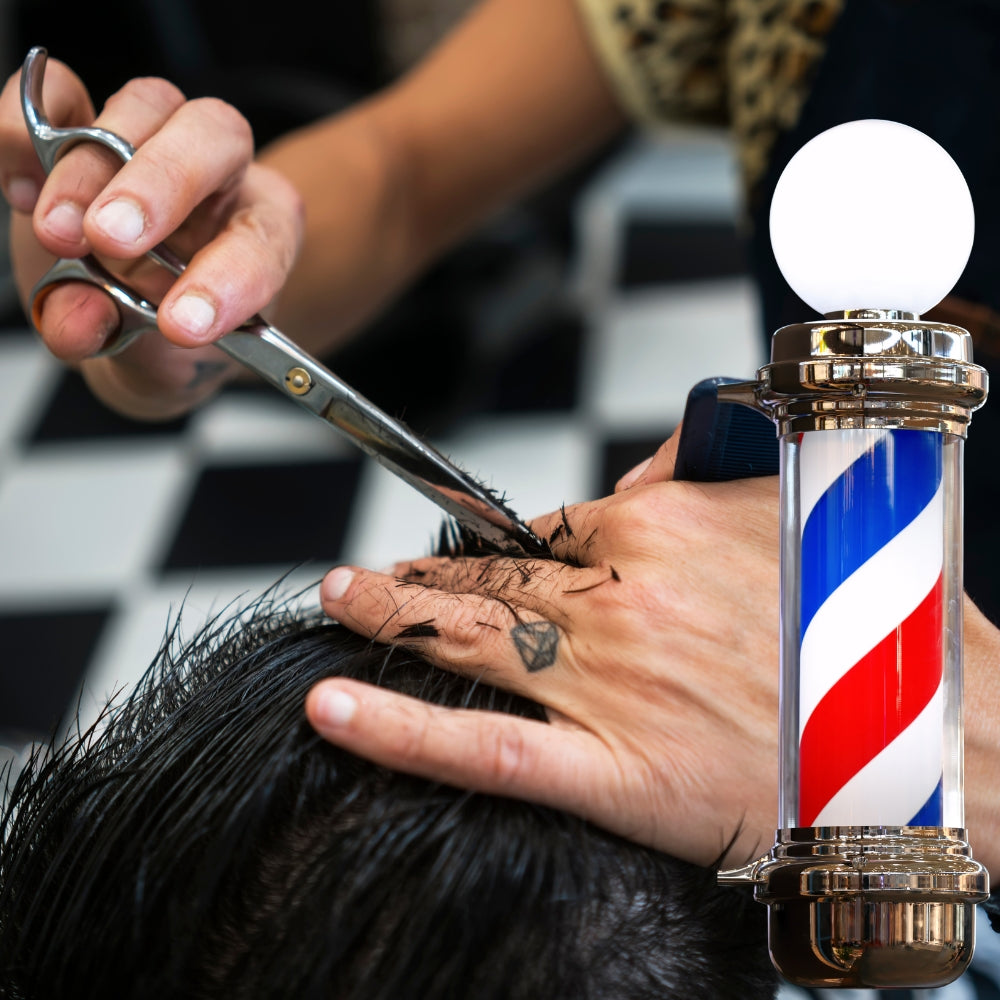 A barber cutting a clients hair in a Barber Shop