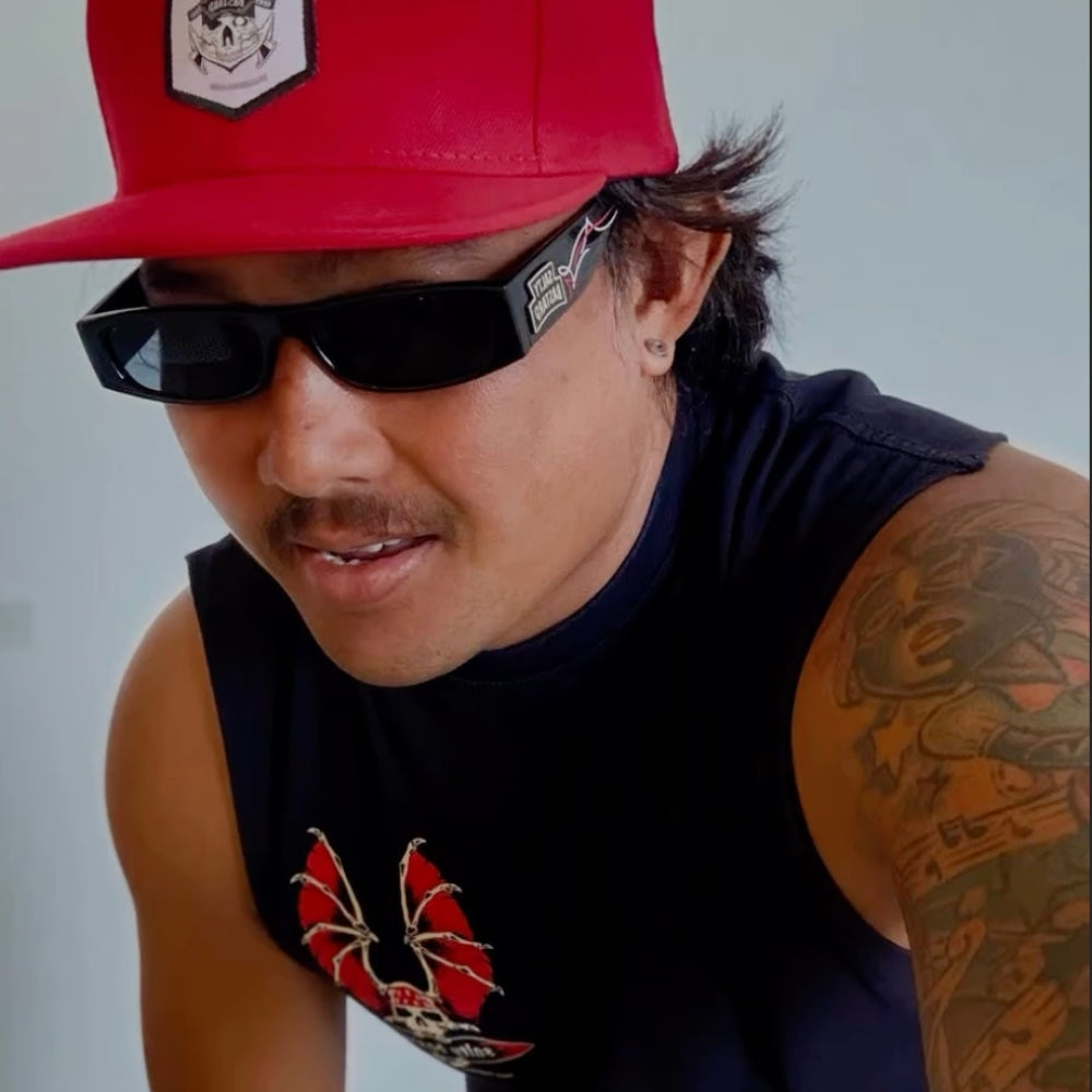 Model wearing a Slaty Bastard hat and Tank Top
