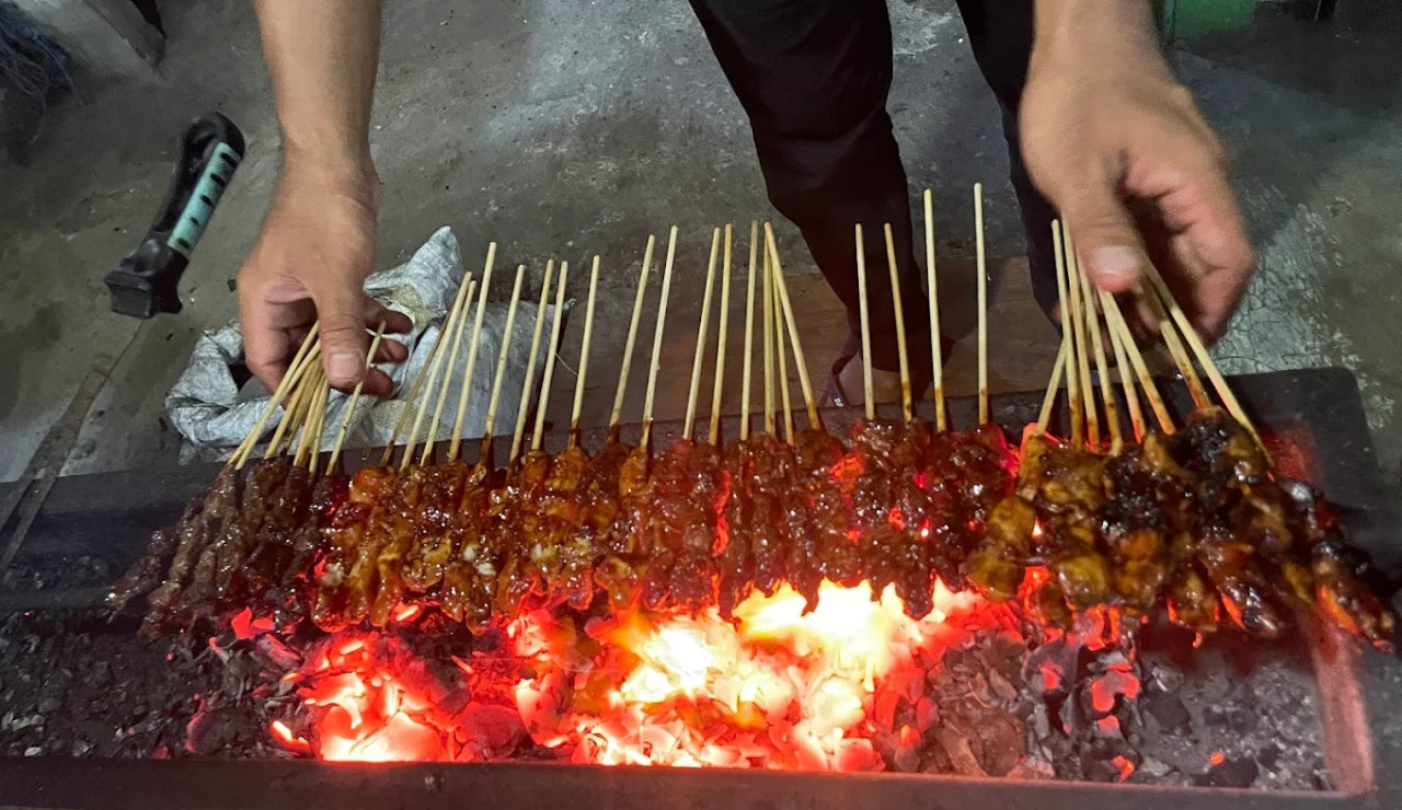 Sate Sticks cooking over charcoal at Warung Madura, Mushroom Bay